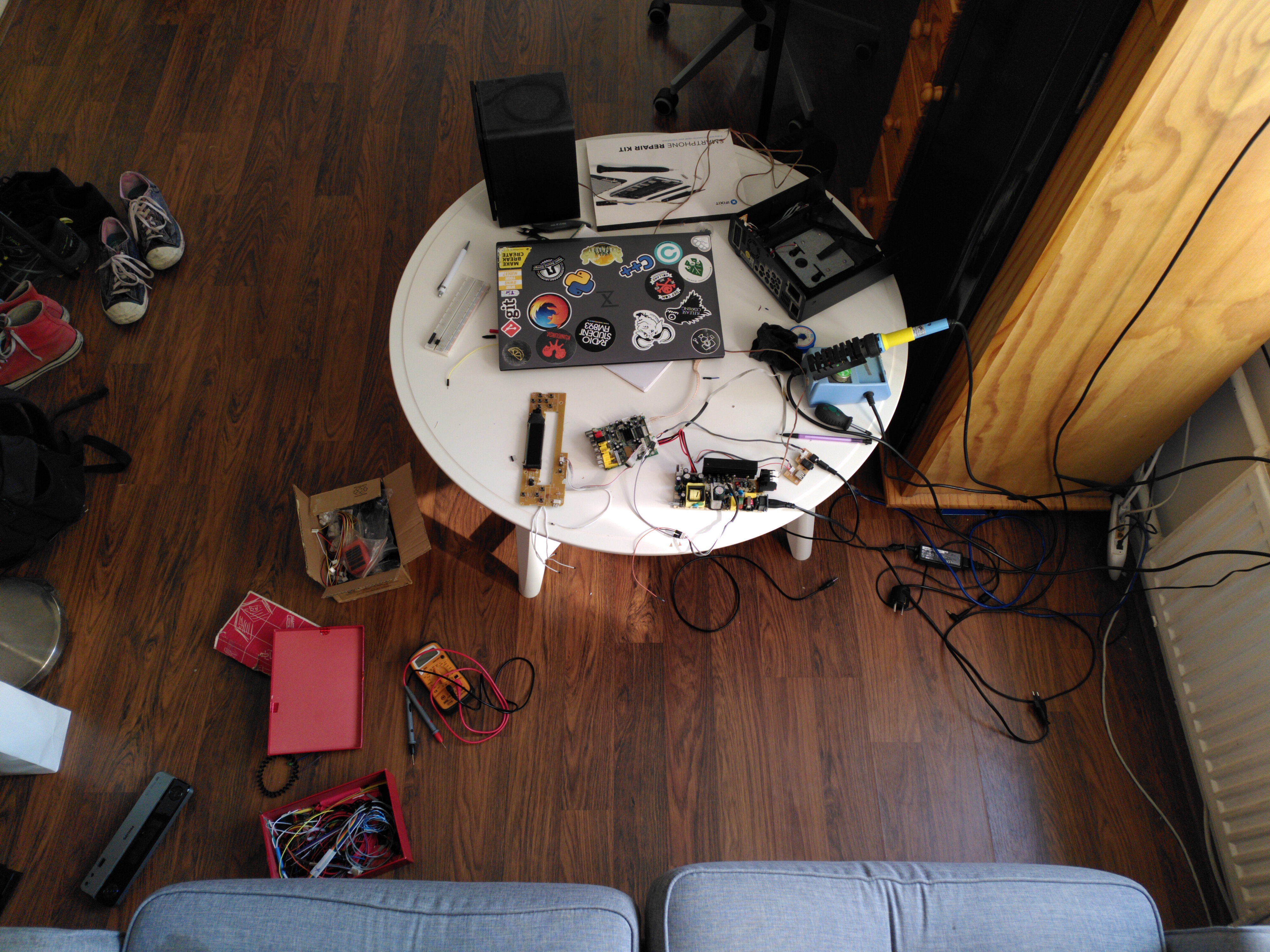 messy workplace, on a sofa and a coffe table