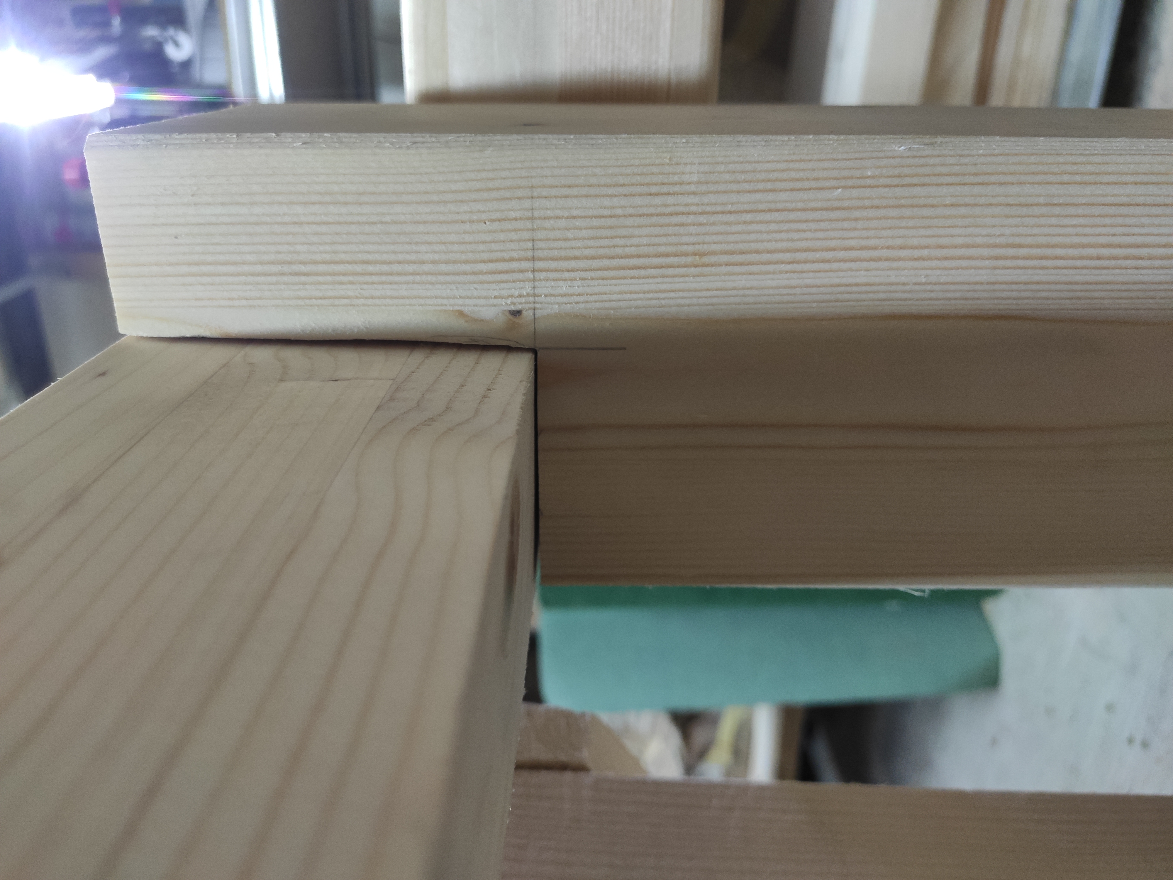 Assembled leg and a horizontal beam, demonstrating the half-lap joint precision.